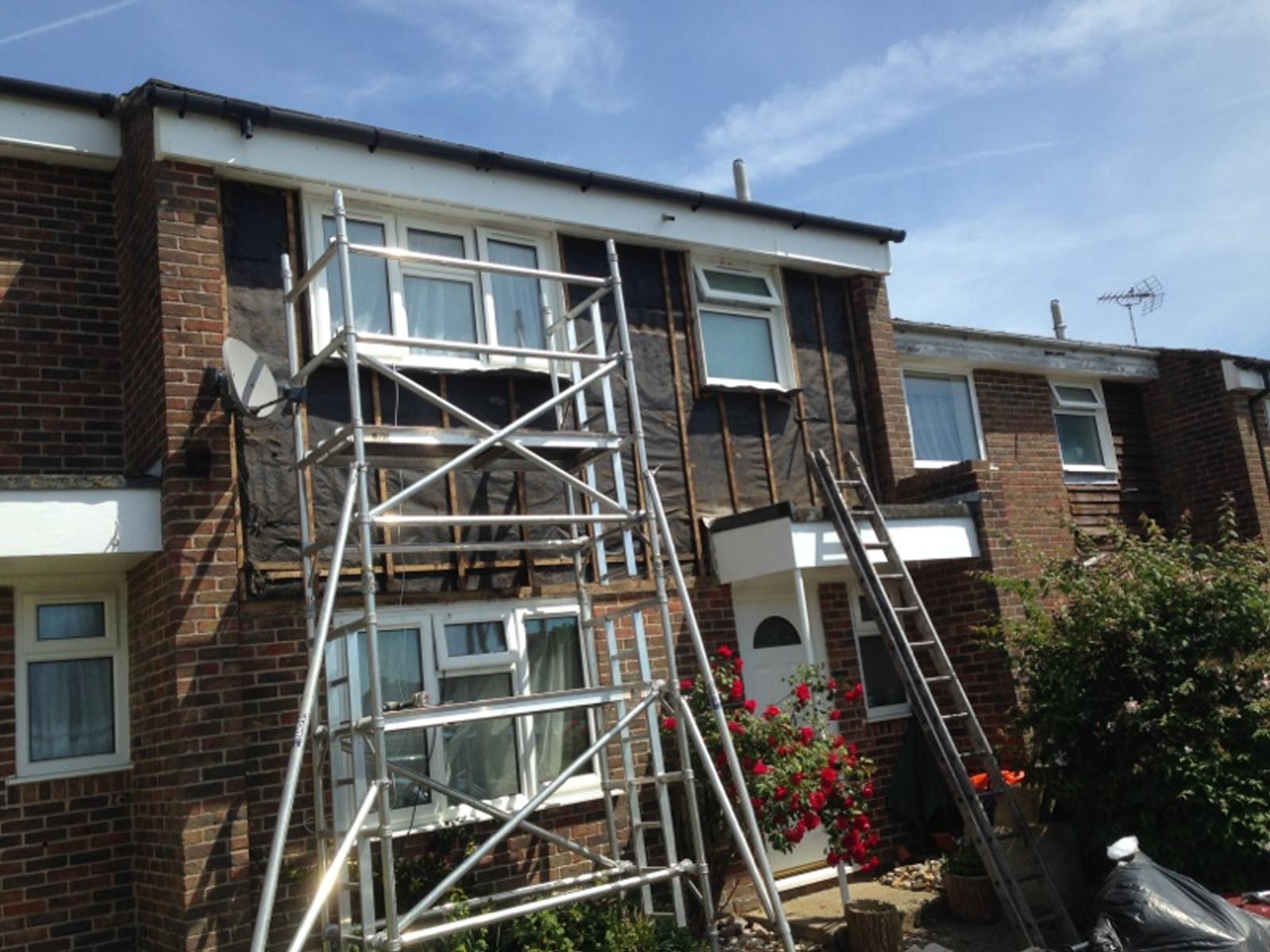 Planned Decorating, scaffolding image on house